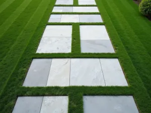 Geometric Paver Pattern - Aerial view of a modern garden path with large-format geometric concrete pavers, separated by artificial grass strips, creating a striking linear pattern