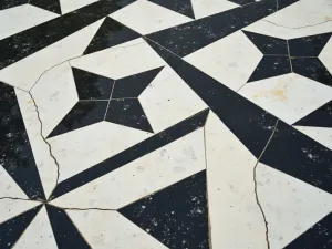 Geometric Pattern Porcelain - Close-up detail of black and white geometric patterned porcelain tiles, creating a striking modern outdoor floor design