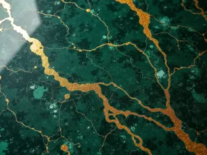 Green Marble Epoxy - Close-up of a deep green marbled epoxy floor with gold veining, reminiscent of luxury stone