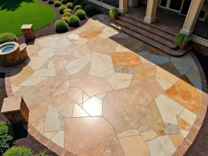 Natural Stone Look Epoxy - Aerial view of a large patio with stone-effect epoxy flooring in earth tones, featuring realistic marble and granite patterns