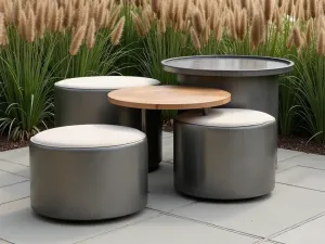 Multi-functional Ottoman Set - Set of three nested weatherproof ottomans that serve as tables and seating, surrounded by tall ornamental grasses, industrial modern style, aerial view