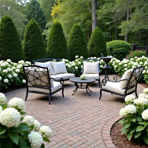 Classic Brick Paver Garden - Traditional brick paver patio in a classic basketweave pattern. White hydrangeas and boxwood hedges frame the space. Classic wrought iron furniture with neutral cushions and a simple water feature.