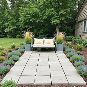 Prairie Style Savings - Budget-conscious rectangular paver patio using basic concrete pavers. Native prairie dropseed and purple prairie clover create natural borders. Simple metal loveseat with prairie-inspired cushions. Recycled steel planters with ornamental grasses.