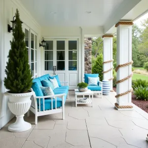 Coastal Mediterranean Hideaway - Salt-finished concrete patio with seashell aggregates under a whitewashed deck. Greek-style furniture in crisp white with azure blue cushions. Grecian urns containing Italian Cypress, Mediterranean Fan Palm, and Trailing Rosemary. Rope-wrapped columns add nautical touch