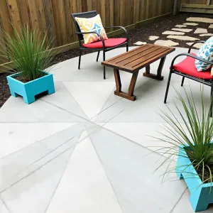 Painted Concrete Garden Lounge - A budget-conscious concrete patio transformed with geometric painted patterns in soft gray and white. Cinder block planters painted in coordinating colors hold snake plants and zebra grass. Simple metal chairs with colorful cushions and a salvaged wood coffee table.