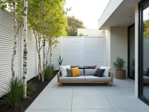 Scandinavian Privacy Screen - A minimalist front patio with white slatted privacy screens and birch trees, featuring clean-lined furniture and simple container plants